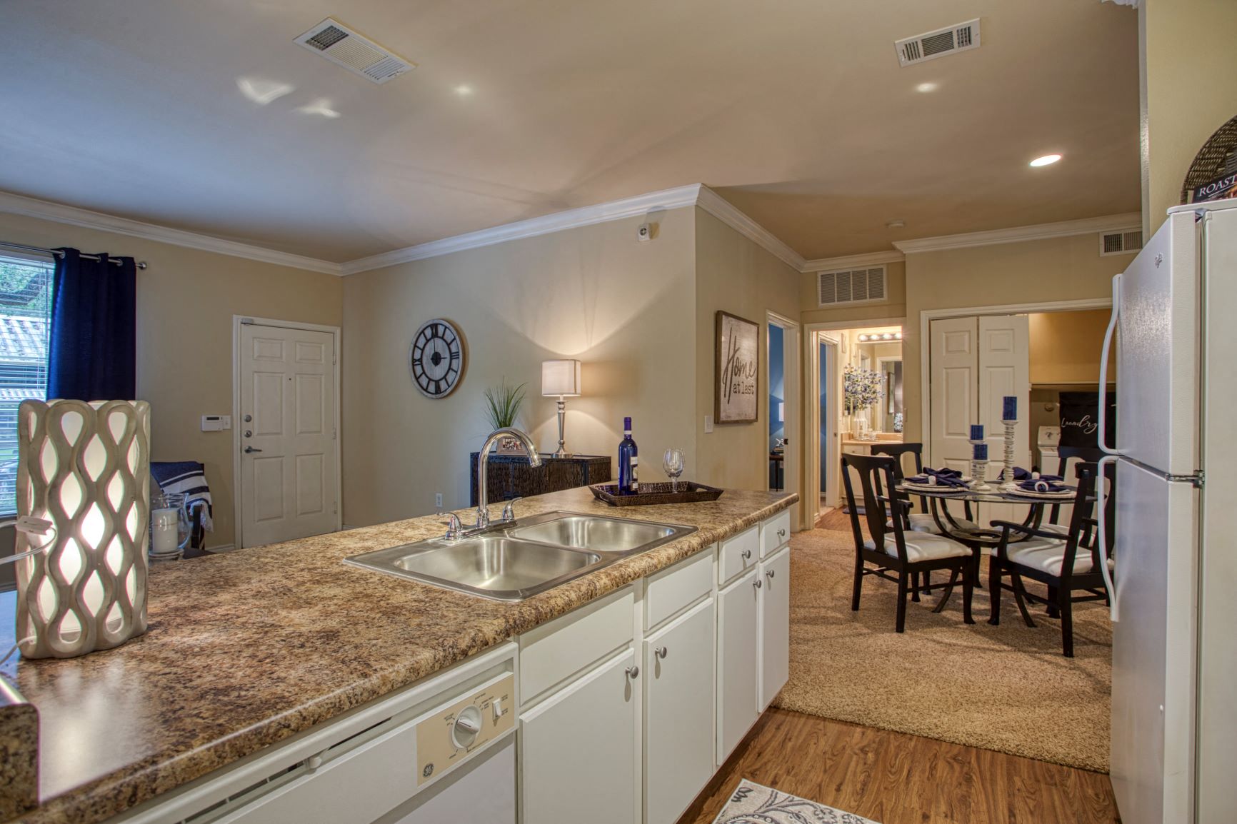 a kitchen with a granite counter top and a sink