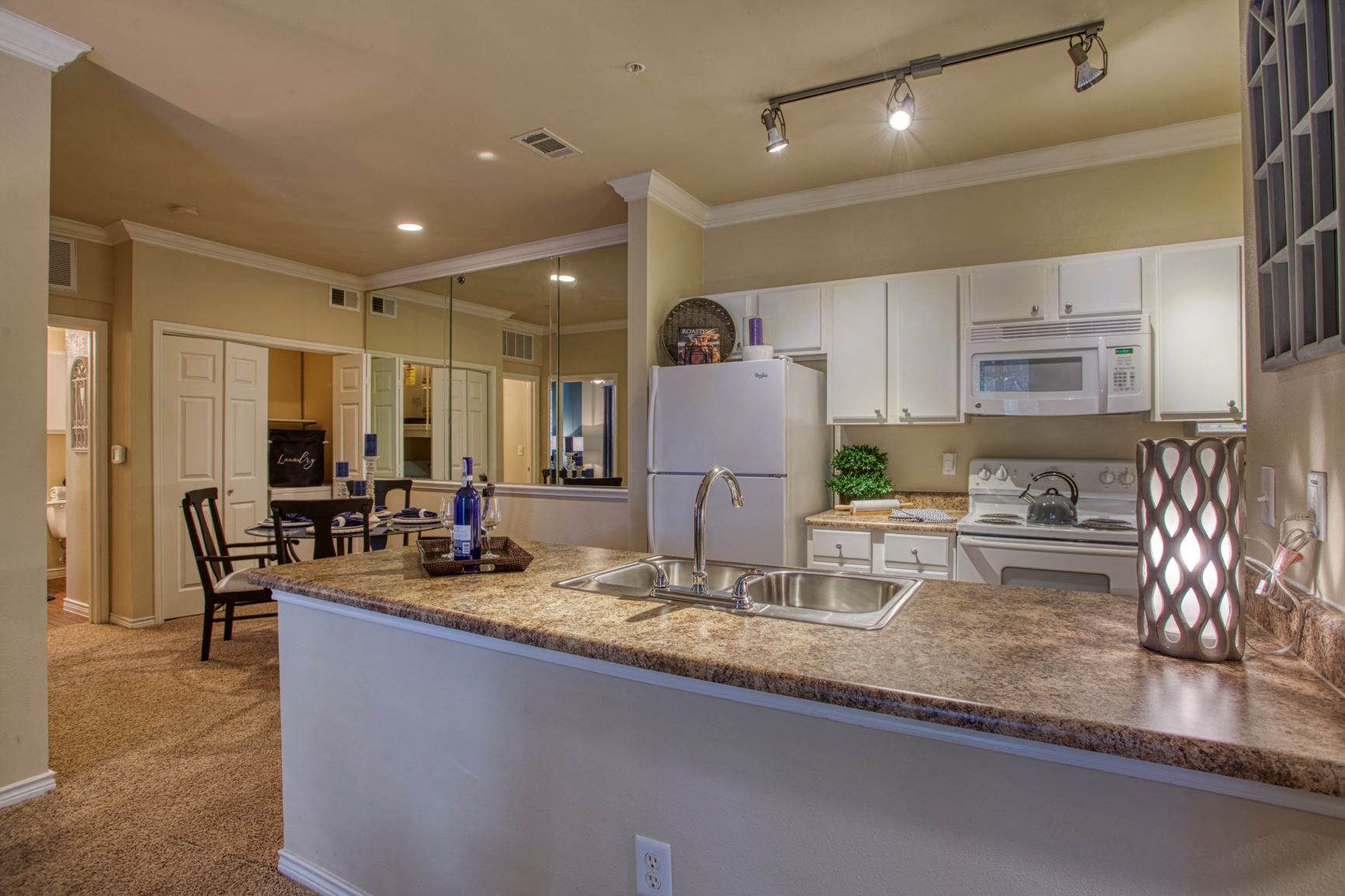 a kitchen with a counter top and a sink