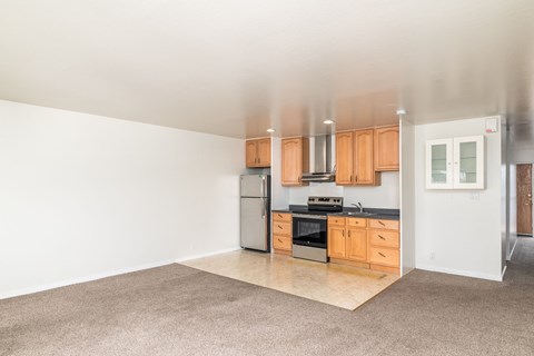 A kitchen with wooden cabinets and stainless steel appliances.
