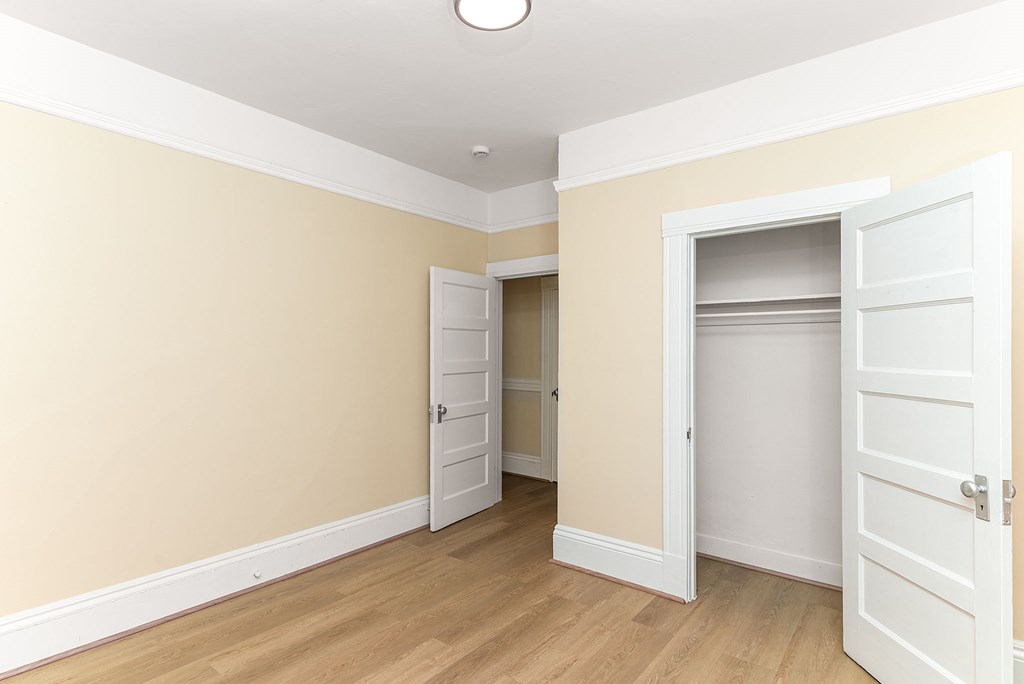 A room with a white ceiling and a white door.