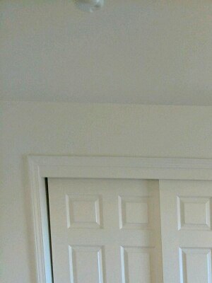 First Bedroom First bedroom showing double closet sliding door. Flooring is carpet.