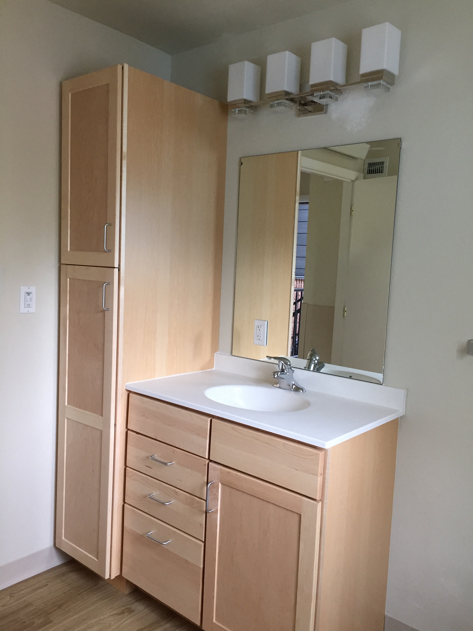 Image of sink, mirror and cabinet