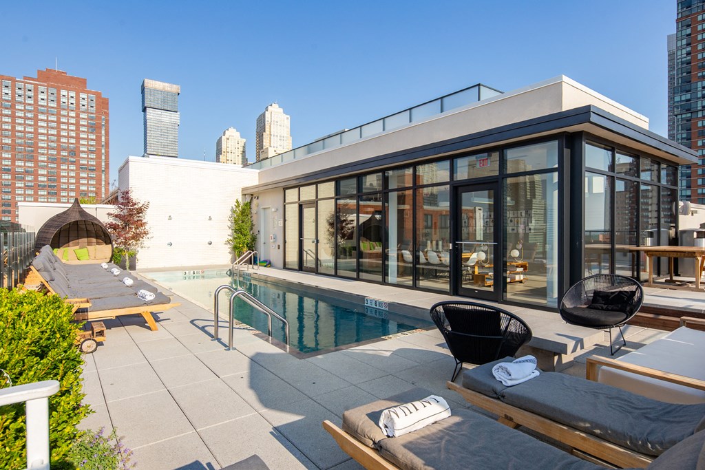 the pool on the rooftop of a building in the city