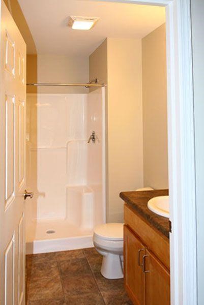 a small bathroom with a toilet and a shower