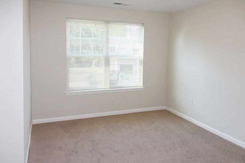 an empty room with a large window