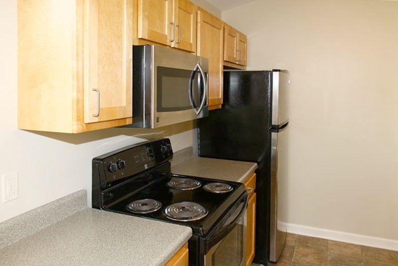 a kitchen with a stove and a refrigerator