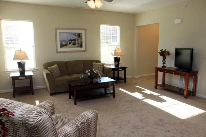 a living room with a couch and a television
