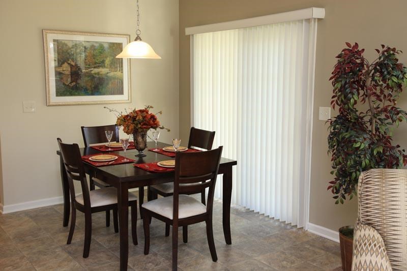 a dining table and chairs in a living room