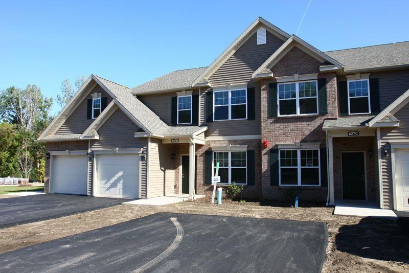 a large house with a garage and a driveway