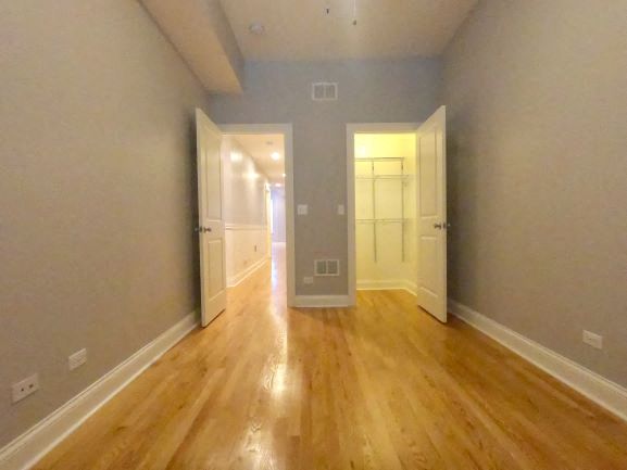 a empty living room with a wood floor