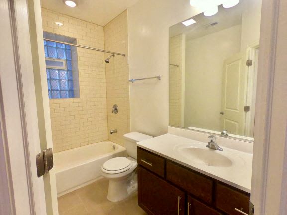 a bathroom with a sink toilet and a shower