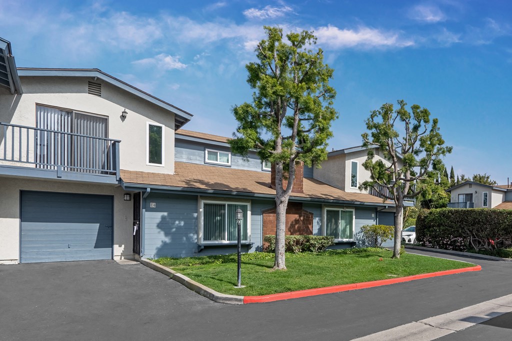 Front View of Units with Single Attached Garage. Two Story Townhome