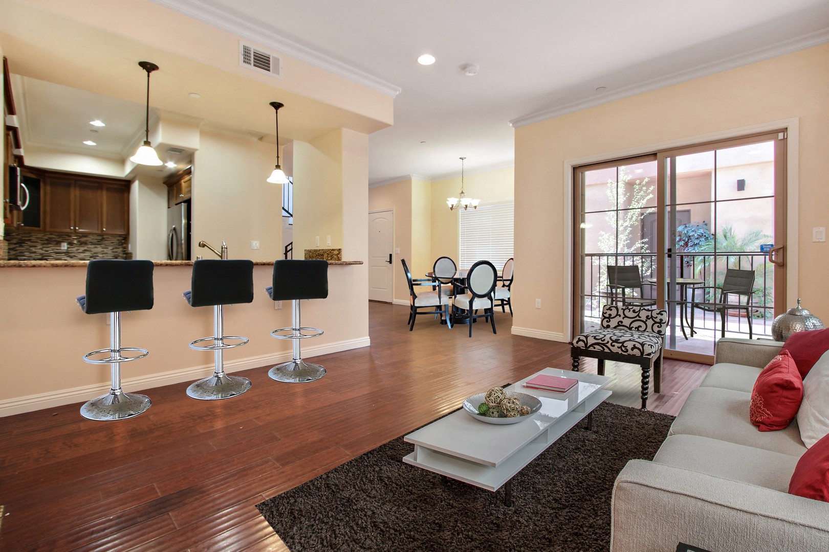 A living room with a white couch and a coffee table.
