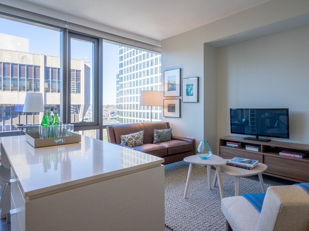a living room with a couch and a table and a television