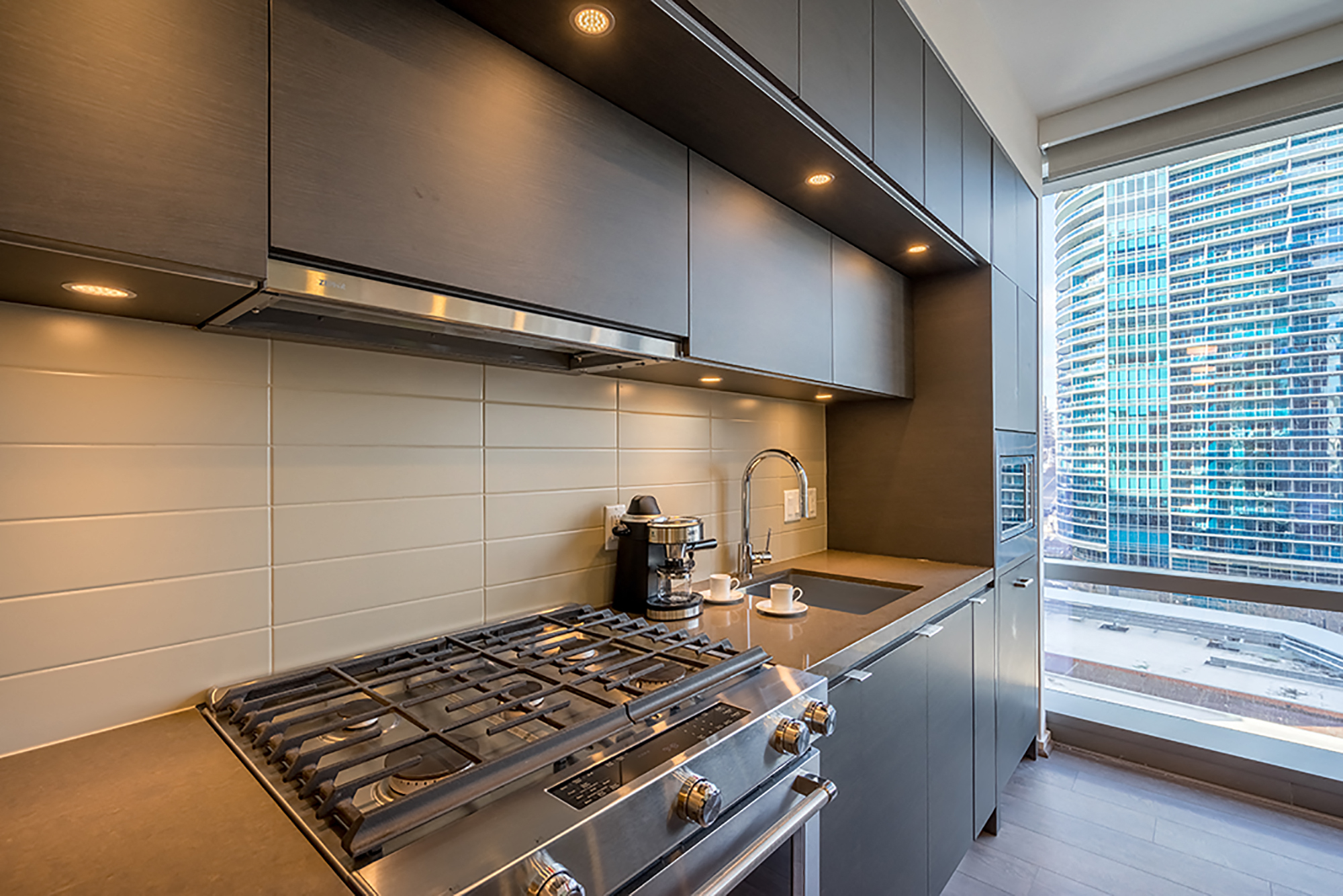 Quartz Countertops and Premium, Ceiling-Height Cabinetry