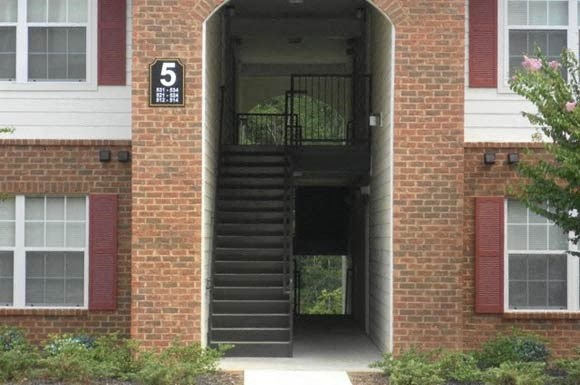 brick and siding exterior at Arbors By The Bay