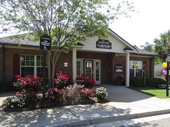 front of clubhouse and office with spring flowers