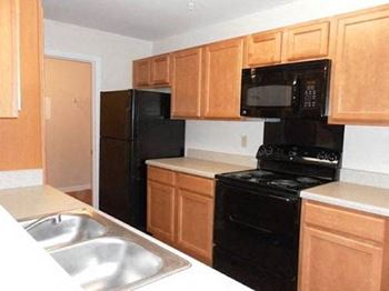sleek black appliances in Arbors kitchen