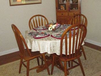 in-home dining area at Arbors By The Bay Apartment