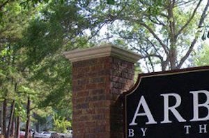 Arbors Sign Entrance sign at Arbors By The Bay Apartment Homes Daphne AL 36526 - Photo Gallery 6