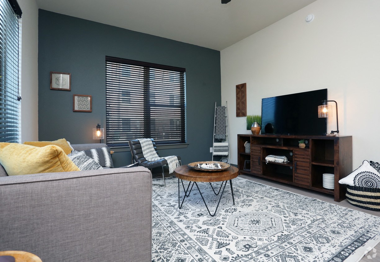 a living room with a couch and a tv
