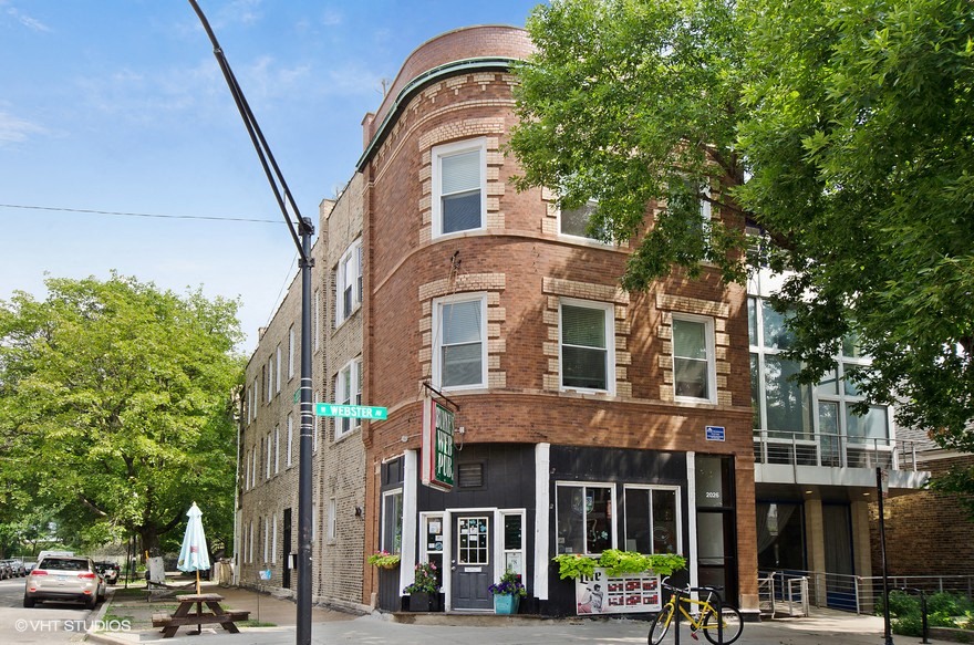 a brick building on the corner of a street