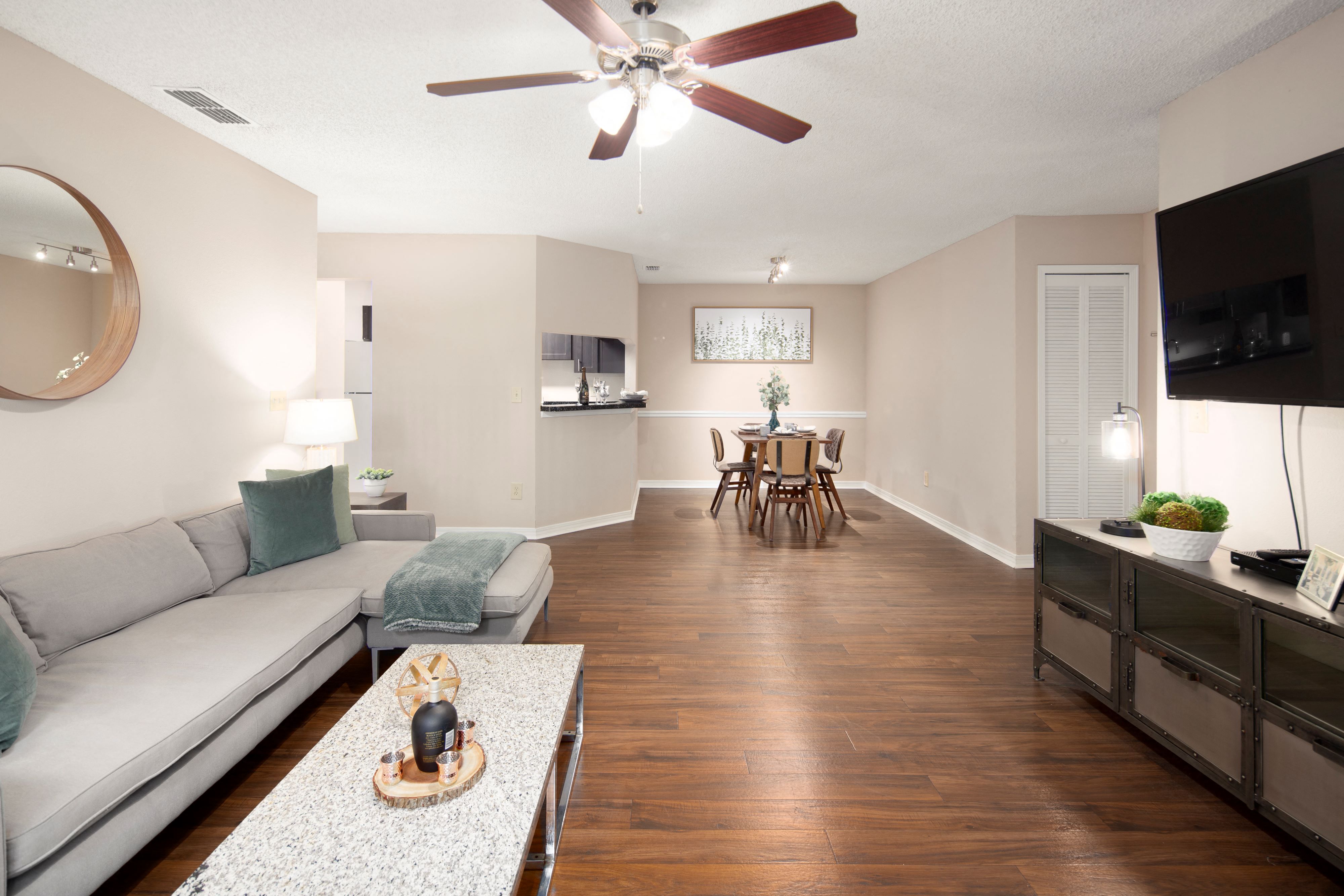 a living room and dining room with a couch and a table