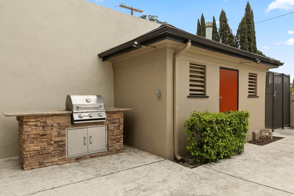 Apartments for Rent in Van Nuys - Colonial Manor - Built-in Barbeque Grill, Small Shrubs, and Outdoor Entrance