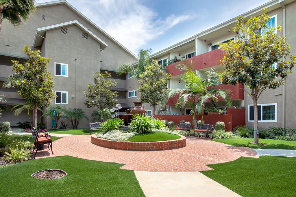 Woodland Hills CA Apartments for Rent - Exterior View of the Property Showcasing Expansive Community and Beautiful Green Landscaping