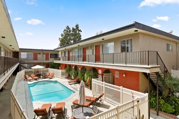 Parkview Terrace Luxury Apartments in Sherman Oaks for Rent - Parkview Terrace Apartments - Swimming Pool with Lounge Chairs and Shaded Table Seating - Photo Gallery 2