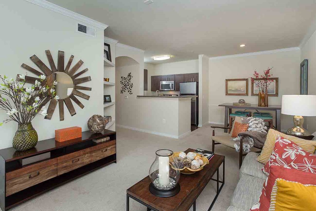 Apartments in The Woodlands for Rent - Whispering Pines Ranch - Furnished Living Room With Stylish Furniture, a Coffee Table, and Carpet Flooring