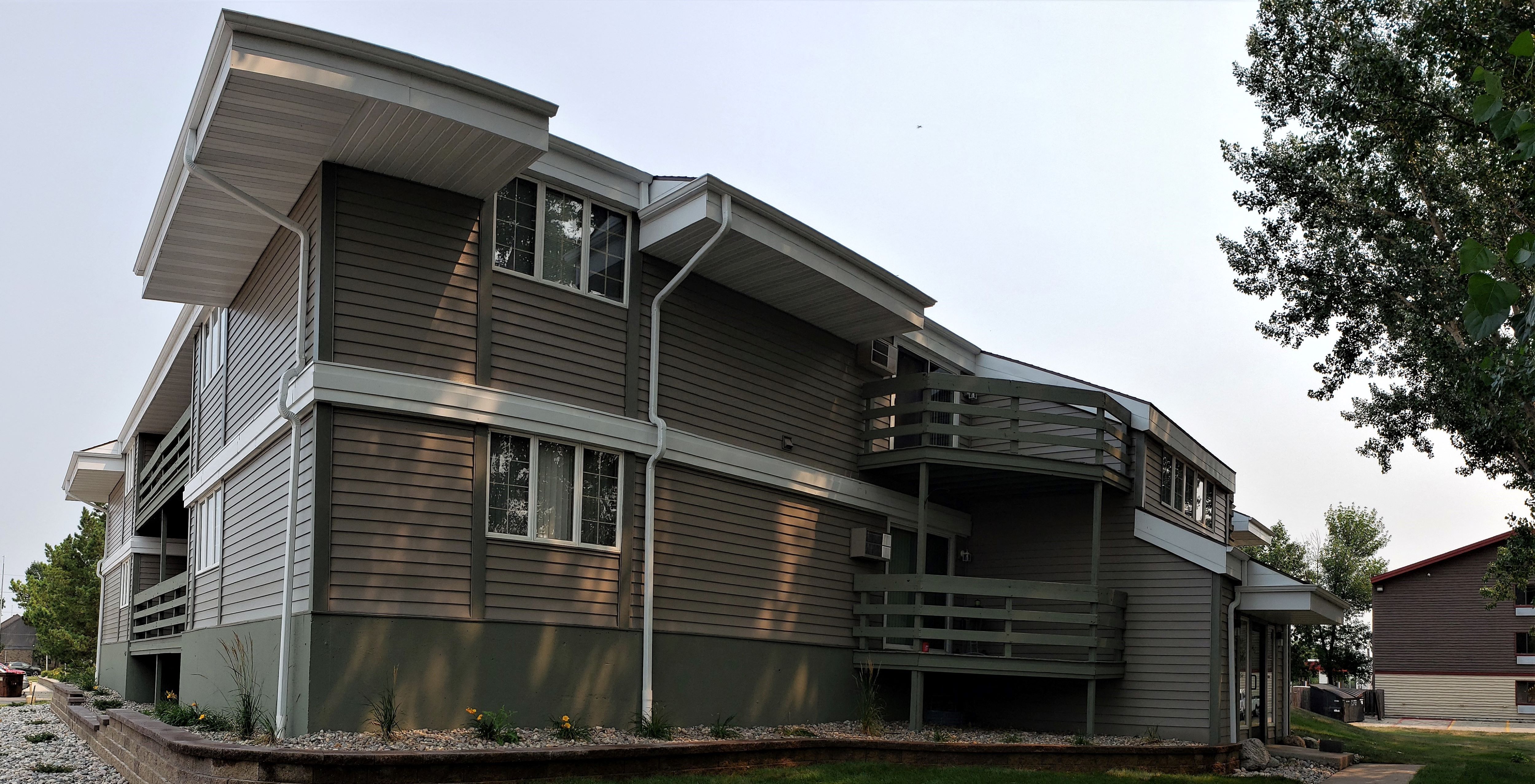 the back of the house has been remodeled with new siding and new windows