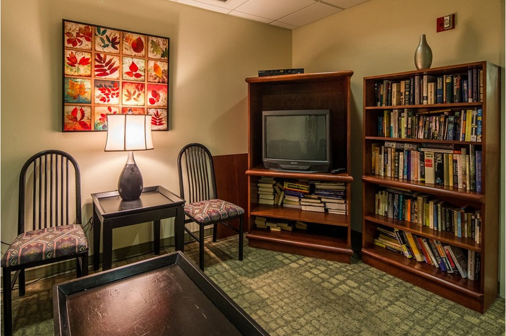 a living room filled with furniture and a television