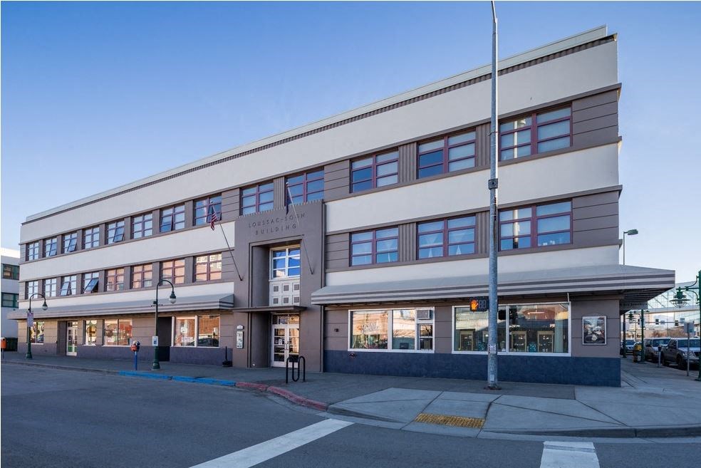 a large building with a street in front of it