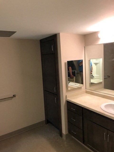 a bathroom with a sink and a mirror