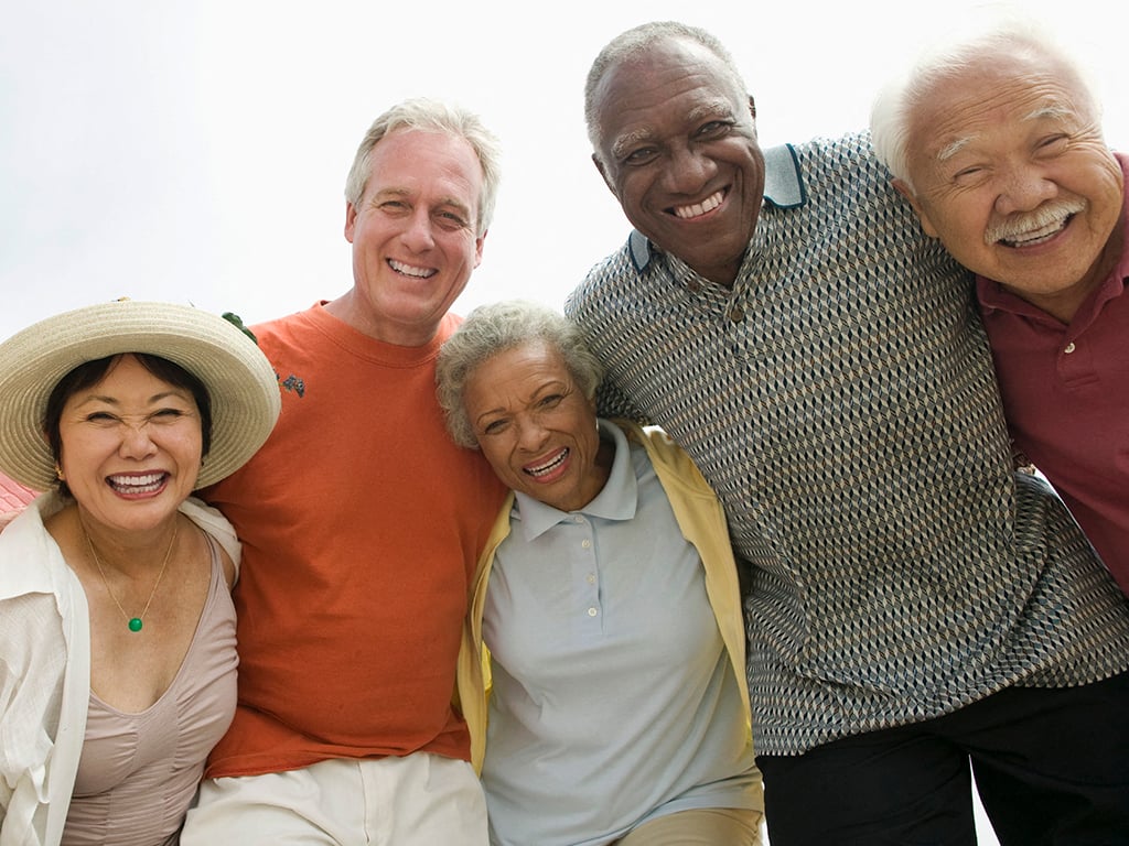 a group of older people posing for a picture