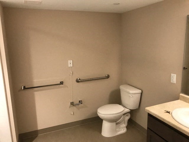 a bathroom with a toilet and a sink