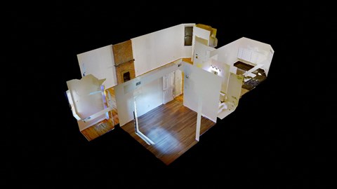 A top down view of a house with a kitchen, living room and bedrooms.