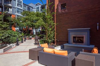 Community Outdoor Lounge With Fireplace at Kearney Plaza Apartments in Portland, Oregon