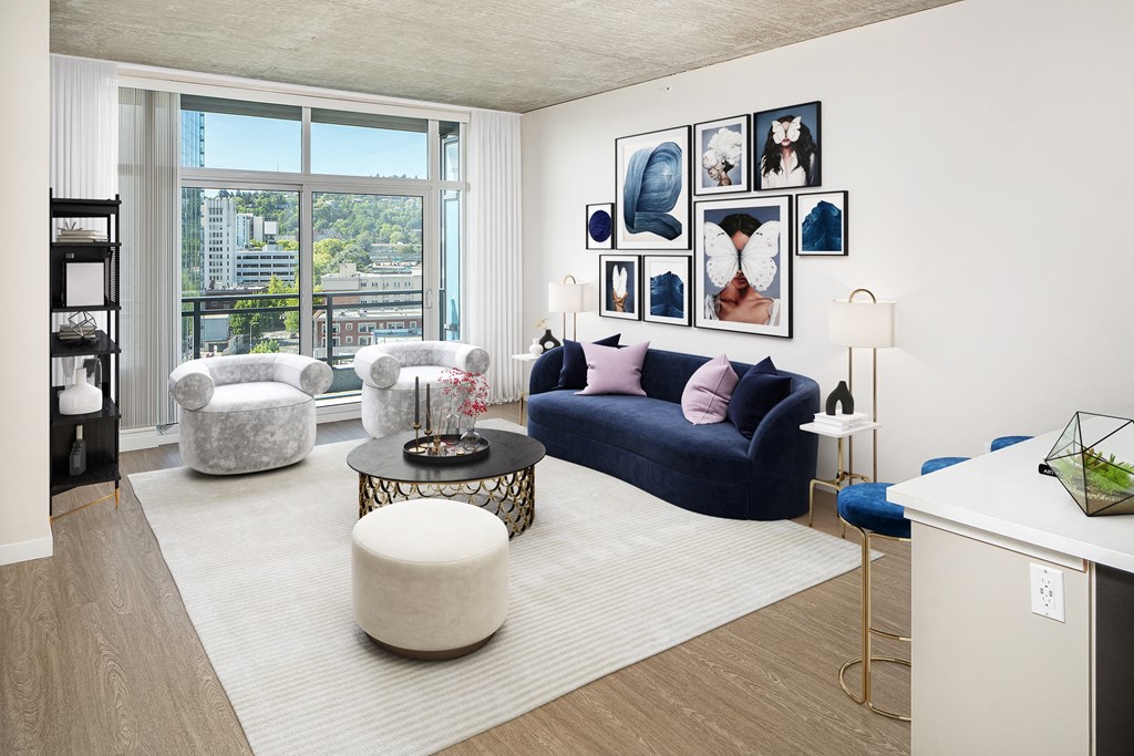 a living room with couches and chairs and a rug