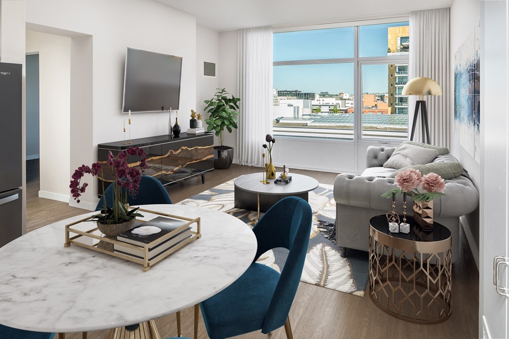 a living room with a couch and a table and a television
