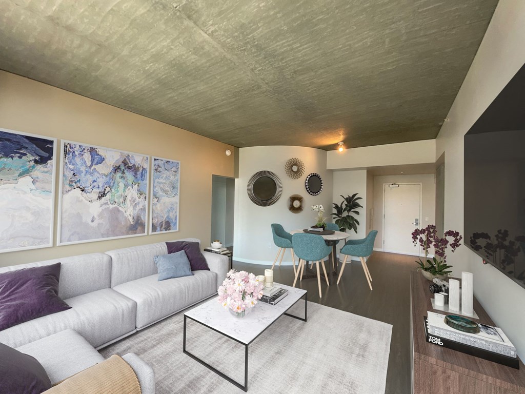 a living room with a white couch and a table