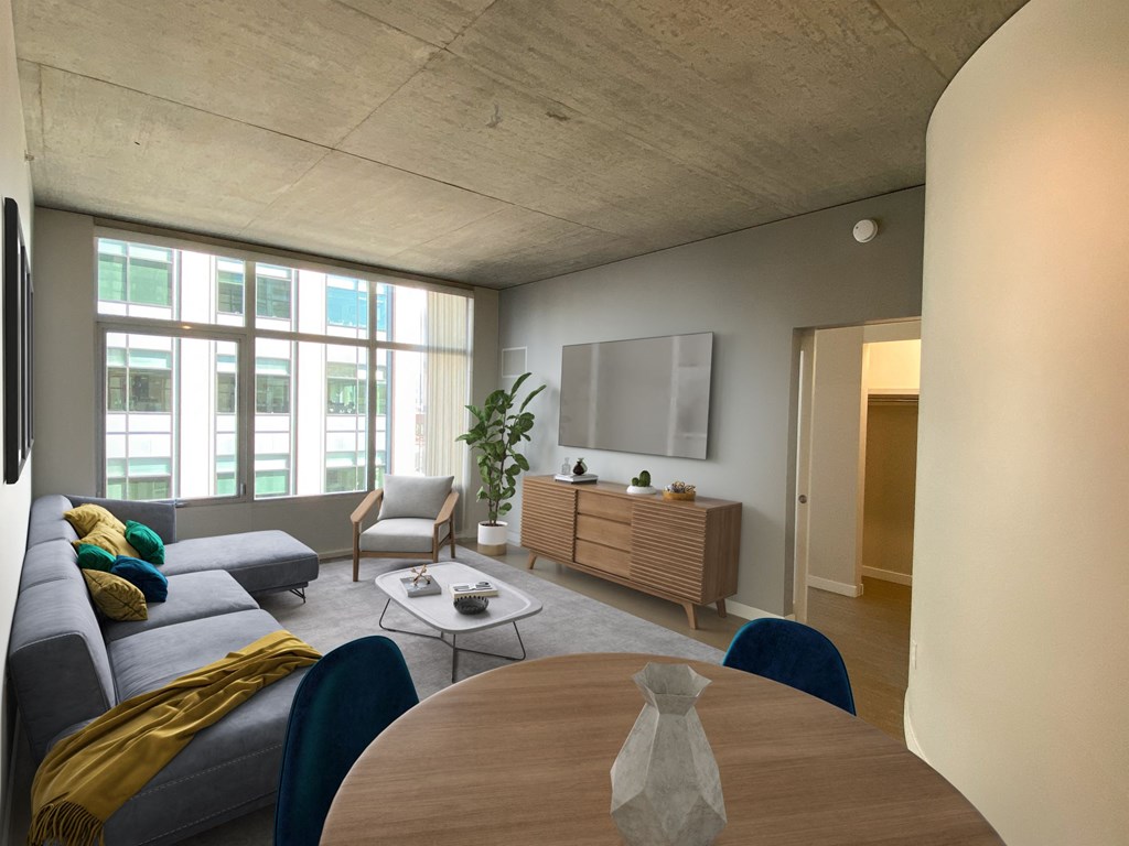 a living room with a couch and a table and a tv