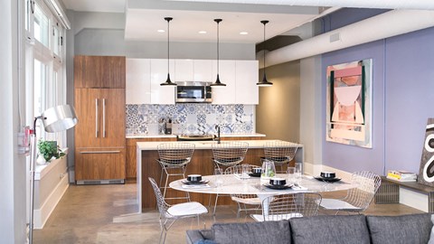 a kitchen and dining room with a table and chairs