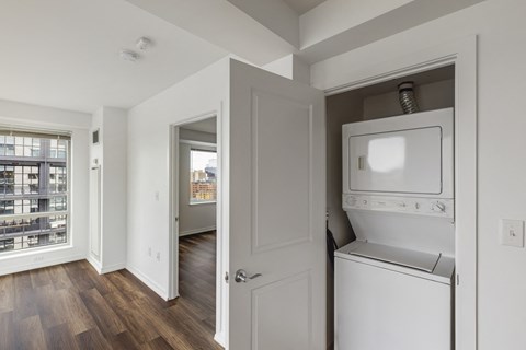 A white oven and dishwasher are built into a wall in a kitchen.