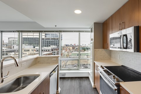 A modern kitchen with a view of the city.