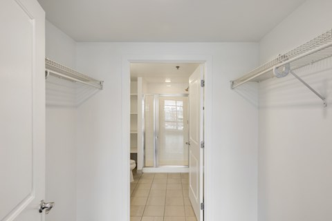 A white hallway with a toilet visible in the distance.