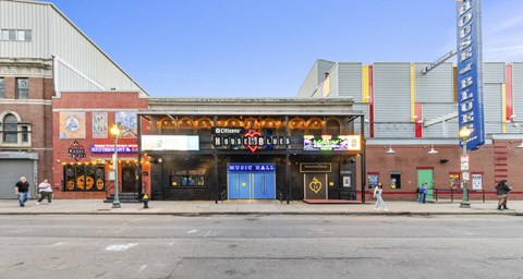 A building with a sign that says "ACREY BROADWAY" on it.