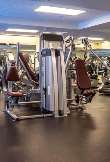a gym with a bunch of exercise equipment in it