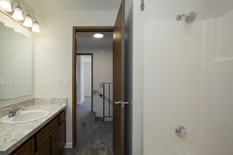 Full Bathroom with Shower and Bath Area and a Vanity Space with a Mirror and Overhead Lighting at Woodlake Townhomes, Edmonds, Washington